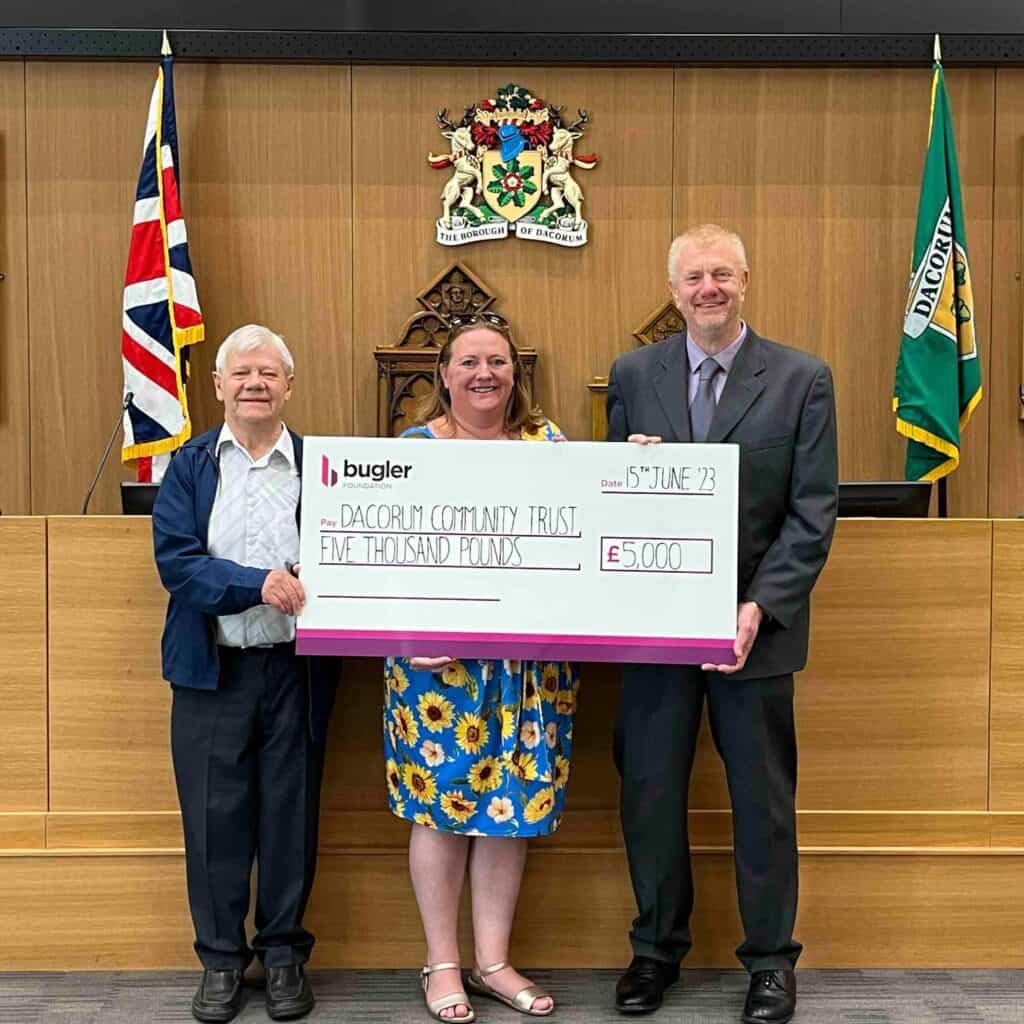 Tony and Claire receiving a cheque at The Forum in Hemel Hempstead